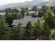 Home's aerial view with neighborhood and mountain views at 5 Catamount Ln, Littleton, CO 80127