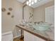 Contemporary bathroom featuring bowl sinks, granite countertops, and modern fixtures at 5 Catamount Ln, Littleton, CO 80127