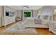 Cozy bedroom with a king-size bed, natural light, and comfortable seating at 5 Catamount Ln, Littleton, CO 80127