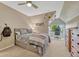 Comfortable bedroom features carpet, a comfy bed, and natural light at 5 Catamount Ln, Littleton, CO 80127