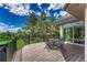 Expansive wooden deck features metal patio furniture, providing an ideal spot for outdoor relaxation at 5 Catamount Ln, Littleton, CO 80127