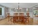 Elegant dining room with a large table, chairs, and neutral decor at 5 Catamount Ln, Littleton, CO 80127