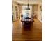 Bright dining room with hardwood floors and a large table with seating for eight at 5 Catamount Ln, Littleton, CO 80127