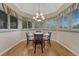 Well-lit dining room with hardwood floors and a chandelier at 5 Catamount Ln, Littleton, CO 80127