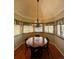 Cozy breakfast nook with a chandelier and views to the outdoors at 5 Catamount Ln, Littleton, CO 80127
