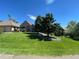 Well maintained lawn with mature trees and beautiful exterior at 5 Catamount Ln, Littleton, CO 80127