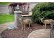 Front yard with a brick walkway, professional landscaping, and local wildlife at 5 Catamount Ln, Littleton, CO 80127