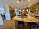 Open kitchen with granite countertops, stainless steel appliances and wooden floors at 5 Catamount Ln, Littleton, CO 80127