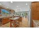Spacious eat-in kitchen featuring wooden floors, stone countertops, and stainless appliances at 5 Catamount Ln, Littleton, CO 80127