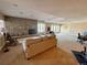 Spacious finished basement with a brick fireplace, carpeted floors and natural lighting at 5 Catamount Ln, Littleton, CO 80127