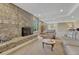 Inviting Gathering room with a cozy fireplace and ample seating at 5 Catamount Ln, Littleton, CO 80127