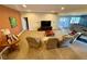 Spacious living room with a cozy seating area and walkout french doors at 5 Catamount Ln, Littleton, CO 80127
