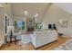 Bright living room features a fireplace, large windows, and neutral-colored furniture at 5 Catamount Ln, Littleton, CO 80127