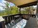 Inviting balcony with outdoor seating and beautiful views of surrounding trees and mountains at 1941 Boreas Pass Rd # 1C, Breckenridge, CO 80424