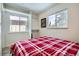 Well-lit bedroom with ample closet space, a comfortable bed, and windows offering pleasant views at 1941 Boreas Pass Rd # 1C, Breckenridge, CO 80424