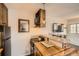 Galley kitchen with an island bar, black appliances and natural light at 1941 Boreas Pass Rd # 1C, Breckenridge, CO 80424