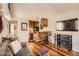 Cozy living room featuring a rustic kitchen bar, comfortable couch and wood flooring at 1941 Boreas Pass Rd # 1C, Breckenridge, CO 80424