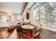 Cozy living room featuring hardwood floors, comfortable seating, and large windows with scenic views at 1941 Boreas Pass Rd # 1C, Breckenridge, CO 80424