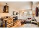 Comfortable living area featuring a breakfast bar, entertainment center, and a couch at 1941 Boreas Pass Rd # 1C, Breckenridge, CO 80424