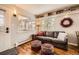 Inviting living room with a cozy couch, decorative shelves, and great natural light at 1941 Boreas Pass Rd # 1C, Breckenridge, CO 80424