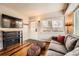 Comfortable living room with TV, sofa and rustic decor elements that create a warm atmosphere at 1941 Boreas Pass Rd # 1C, Breckenridge, CO 80424