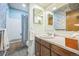 Functional bathroom featuring a tub with shower curtain, vanity with sink, and ample lighting at 490 Potomac Way, Aurora, CO 80012
