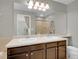 Bathroom featuring a double sink vanity, a large mirror, and modern fixtures at 1234 Riddlewood Ln, Highlands Ranch, CO 80129