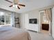 Comfortable bedroom featuring a bed, a ceiling fan, and natural light at 1234 Riddlewood Ln, Highlands Ranch, CO 80129