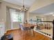 Dining room with hardwood floors, a chandelier, and bright natural light at 1234 Riddlewood Ln, Highlands Ranch, CO 80129