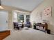 Cozy living room featuring large windows, comfortable seating, and stylish decor at 1234 Riddlewood Ln, Highlands Ranch, CO 80129