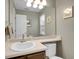 Powder room with a sink, faucet, and a mirror at 1234 Riddlewood Ln, Highlands Ranch, CO 80129