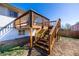 Wooden stairs and deck leading to backyard, creating a relaxing retreat for outdoor living at 846 E 114Th Pl, Northglenn, CO 80233