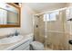 Updated bathroom featuring tiled shower, glass doors, modern vanity, and neutral color palette at 846 E 114Th Pl, Northglenn, CO 80233
