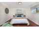 Bright bedroom with hardwood floors, a decorative wall piece, and natural light at 846 E 114Th Pl, Northglenn, CO 80233