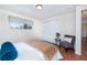 Cozy bedroom featuring hardwood floors, a closet, and a window bringing in natural light at 846 E 114Th Pl, Northglenn, CO 80233