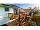 Wooden deck featuring classic railings and stairs down to yard, providing outdoor living space at 846 E 114Th Pl, Northglenn, CO 80233