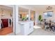 Open-concept layout showcasing the kitchen, dining area, and living room with hardwood floors at 846 E 114Th Pl, Northglenn, CO 80233