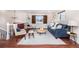 Spacious living room boasts hardwood floors, contemporary furnishings, and plenty of natural light at 846 E 114Th Pl, Northglenn, CO 80233