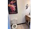 Bathroom with toilet, rustic vanity and vintage Cinzano wall art at 1285 N Colorado Blvd # 4, Denver, CO 80206