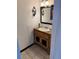 Rustic bathroom with wood vanity cabinet and ceramic tile flooring at 1285 N Colorado Blvd # 4, Denver, CO 80206