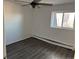 Bright bedroom features wood-look floors, a ceiling fan, and a window with great natural light at 1285 N Colorado Blvd # 4, Denver, CO 80206