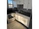 Cozy kitchen with stainless steel appliances, granite-look countertops, and tiled backsplash at 1285 N Colorado Blvd # 4, Denver, CO 80206