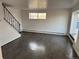 Spacious living room with modern staircase, picture window, and wood-look flooring at 1285 N Colorado Blvd # 4, Denver, CO 80206