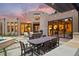 Charming backyard with stone patio, fireplace, dining area, and seamless access to indoor living space at 9 Polo Field Ln, Denver, CO 80209