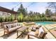Beautiful backyard with a swimming pool, hot tub, and dining area at 9 Polo Field Ln, Denver, CO 80209