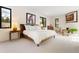 Spacious bedroom with large windows, offering plenty of natural light and ample closet space at 9 Polo Field Ln, Denver, CO 80209