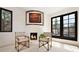 Cozy room featuring fireplace, beamed ceilings and seating at 9 Polo Field Ln, Denver, CO 80209