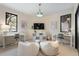Bright, spacious flex room with large windows, plush seating, and built-in storage at 9 Polo Field Ln, Denver, CO 80209