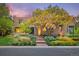 Charming home featuring professionally landscaped grounds and an inviting brick walkway leading to the front door at 9 Polo Field Ln, Denver, CO 80209