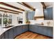 Modern kitchen with stone countertops, light blue cabinetry and stainless steel appliances at 9 Polo Field Ln, Denver, CO 80209